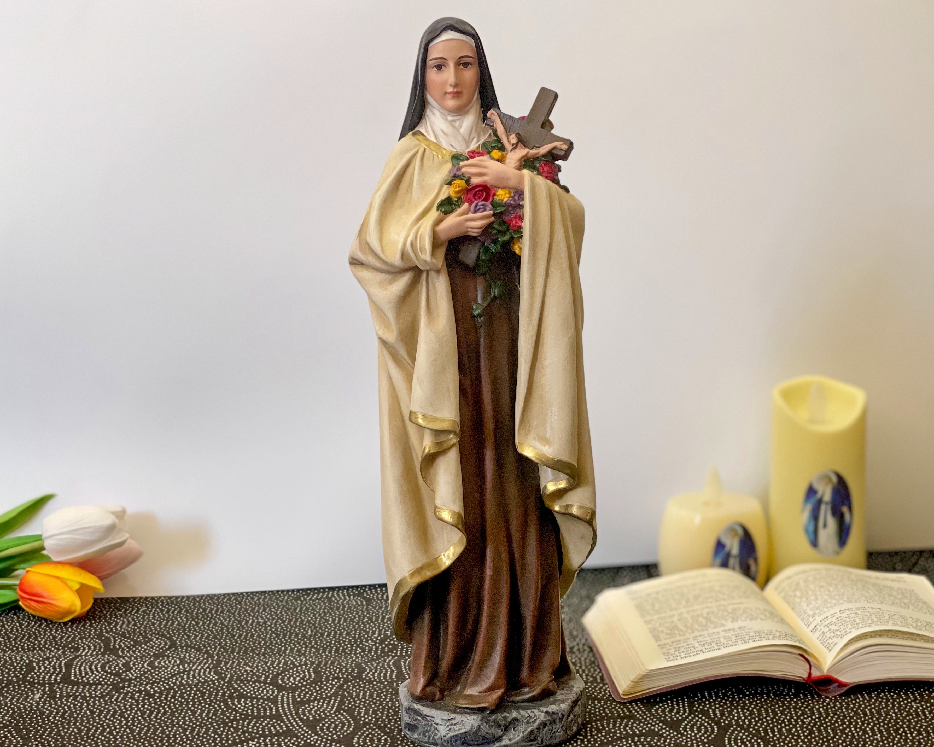 Hand-painted Saint Therese of Lisieux statue holding crucifix and roses