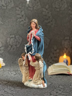 Hand-painted Our Lady Undoer of Knots statue with angels and ribbon detail