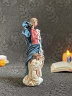 Hand-painted Our Lady Undoer of Knots statue with angels and ribbon detail