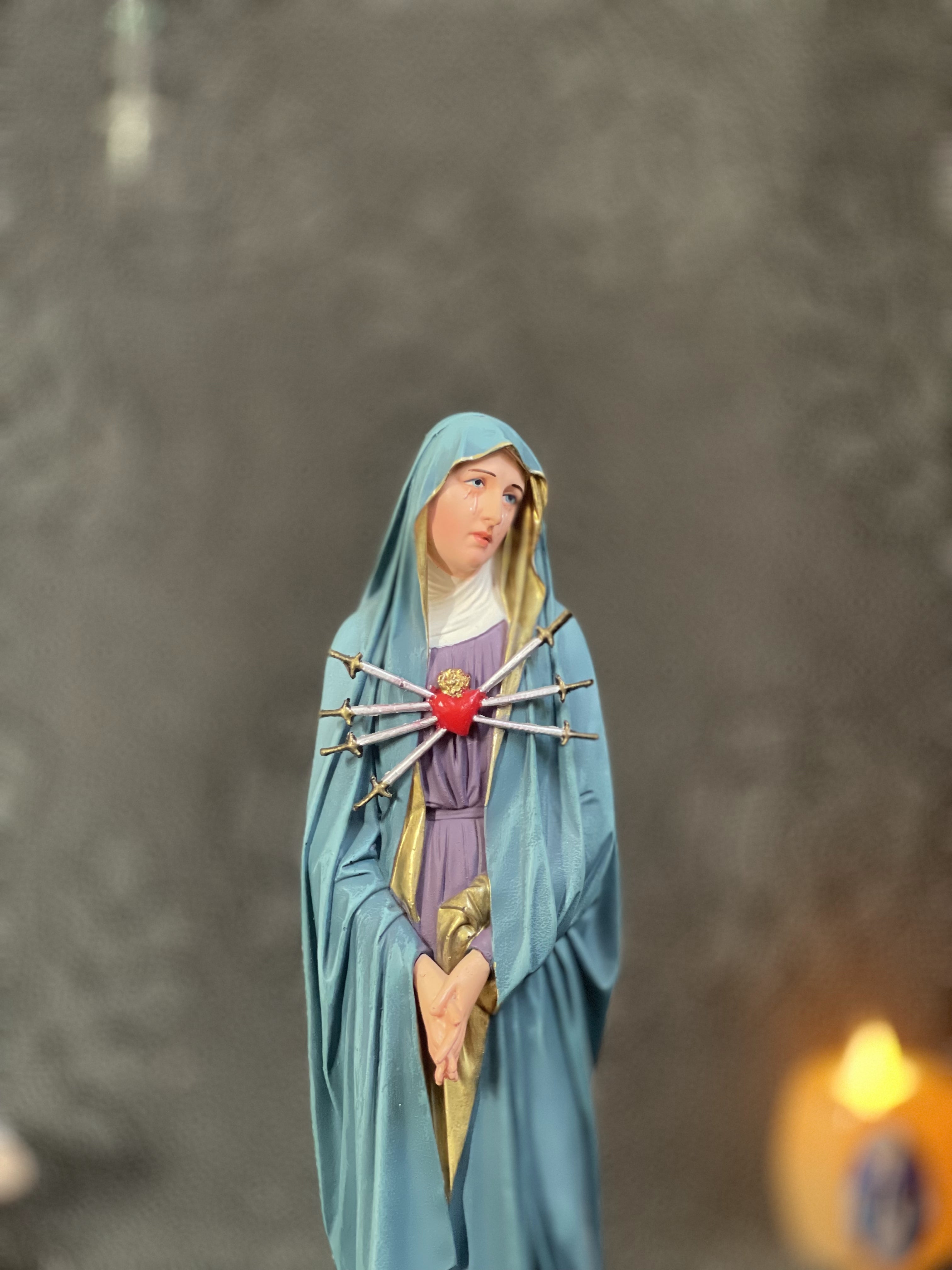 Hand-painted Our Lady of Sorrows statue with blue mantle, pierced heart, and seven swords