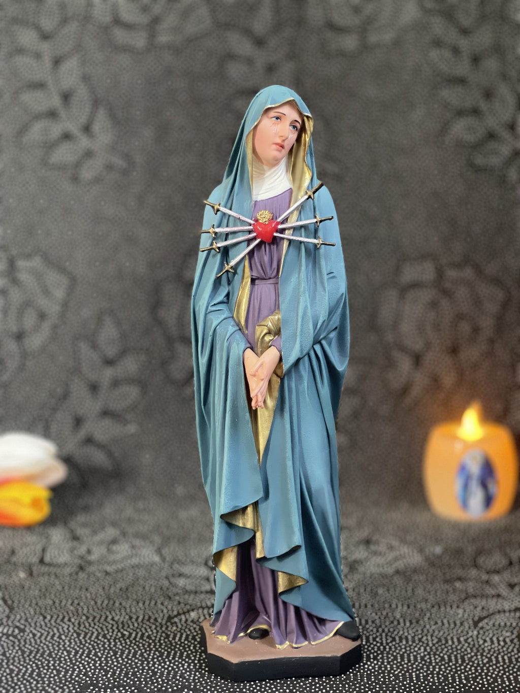 Hand-painted Our Lady of Sorrows statue with blue mantle, pierced heart, and seven swords