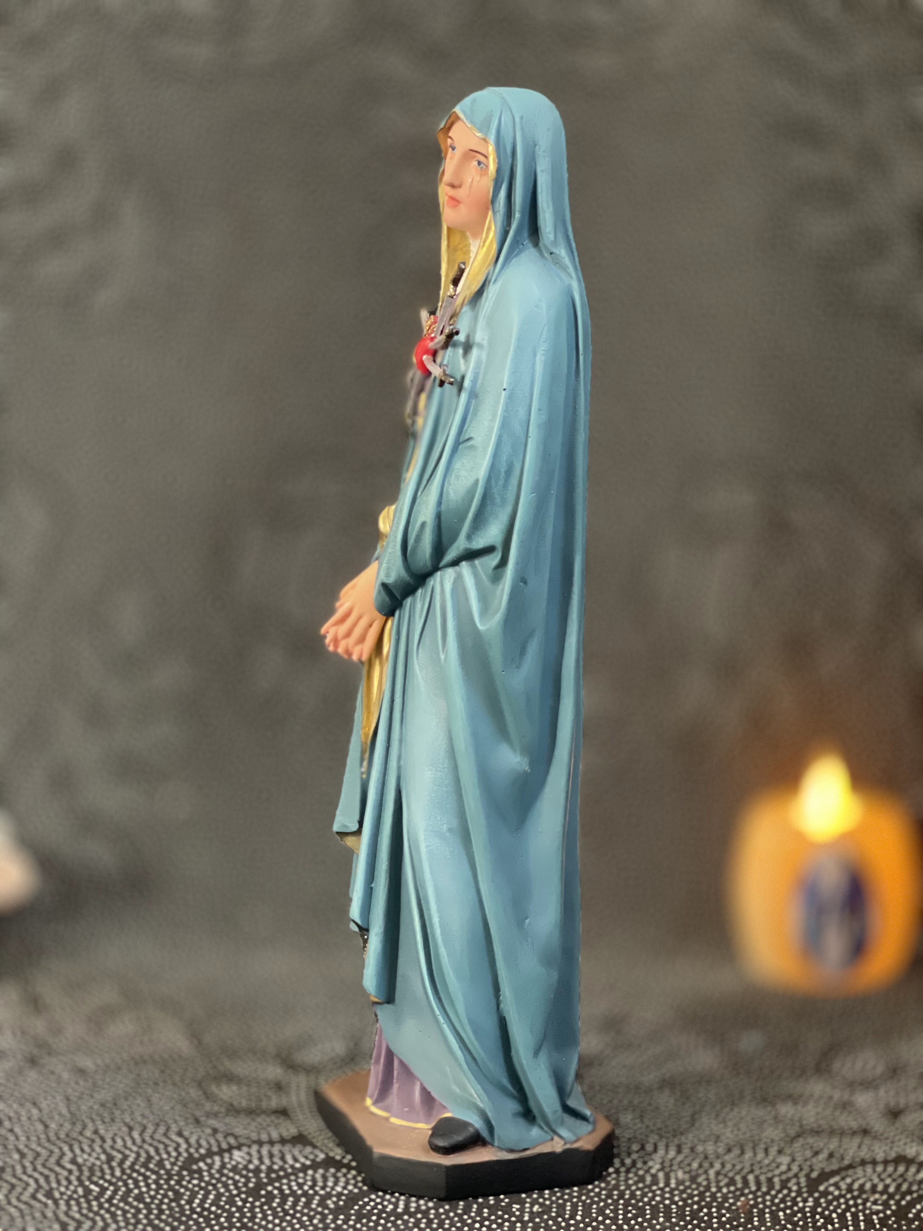 Hand-painted Our Lady of Sorrows statue with blue mantle, pierced heart, and seven swords