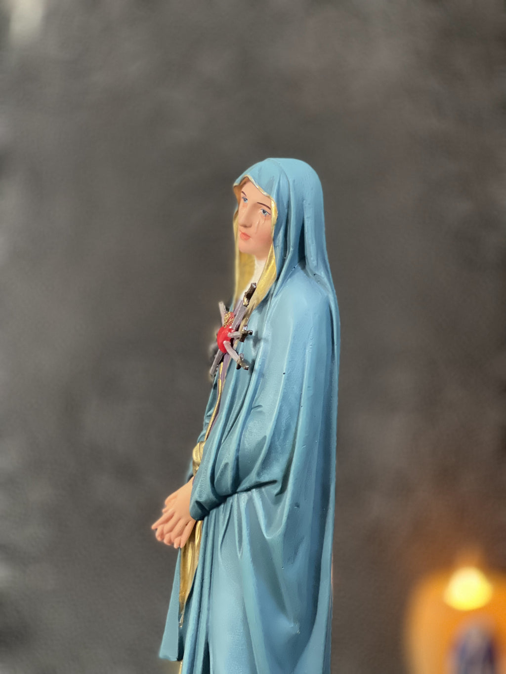 Hand-painted Our Lady of Sorrows statue with blue mantle, pierced heart, and seven swords