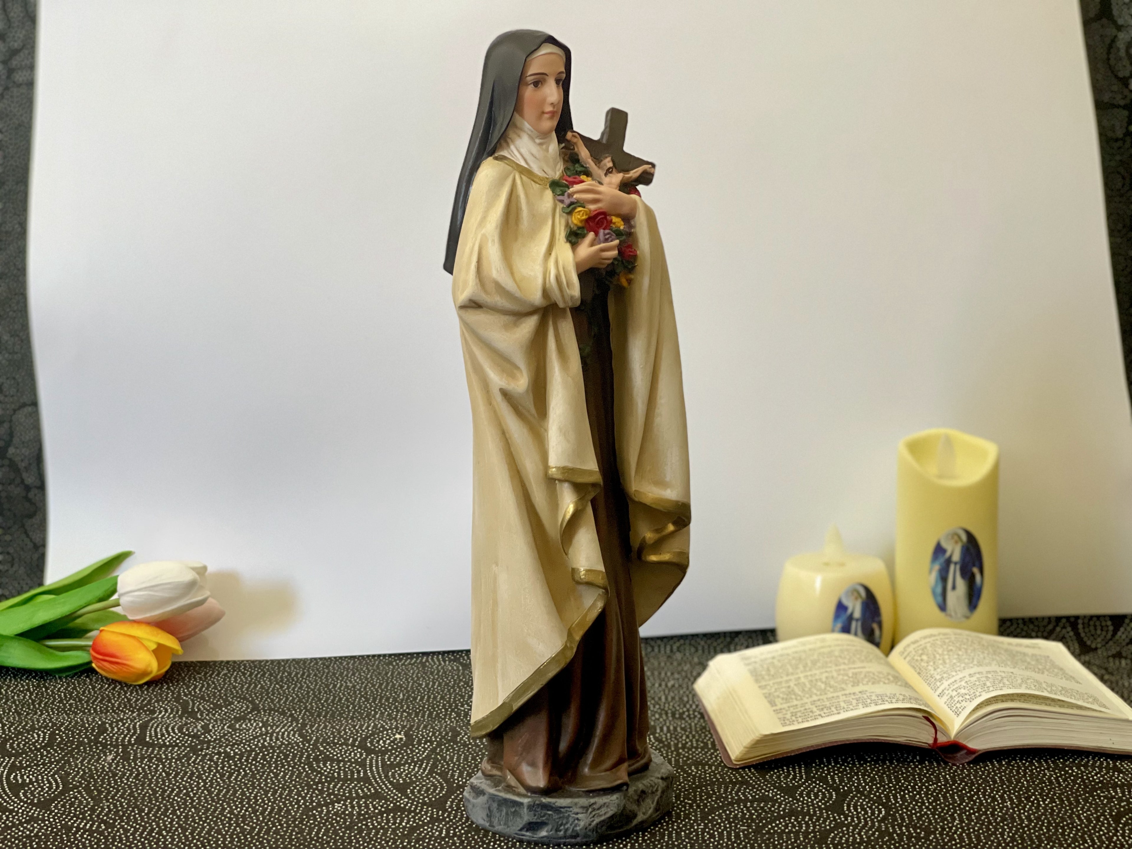 Hand-painted Saint Therese of Lisieux statue holding crucifix and roses