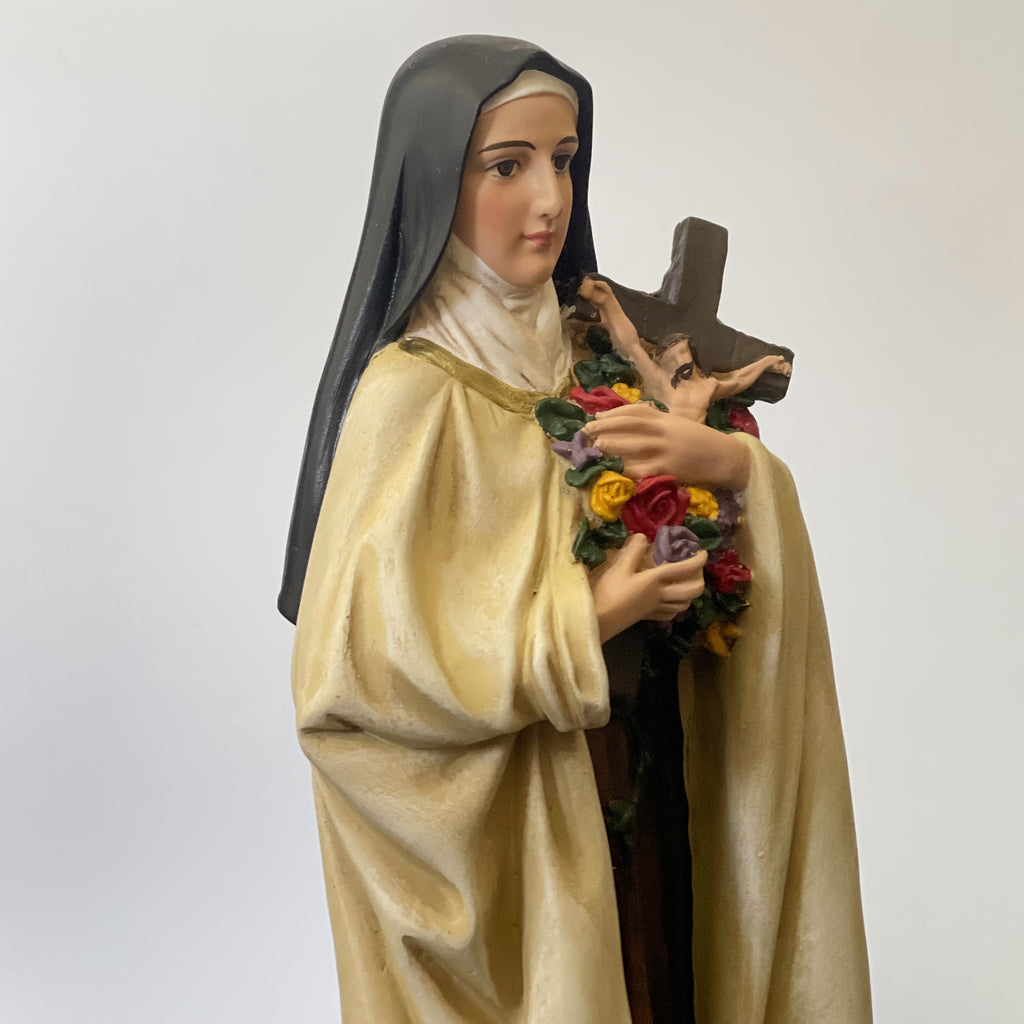 Hand-painted Saint Therese of Lisieux statue holding crucifix and roses