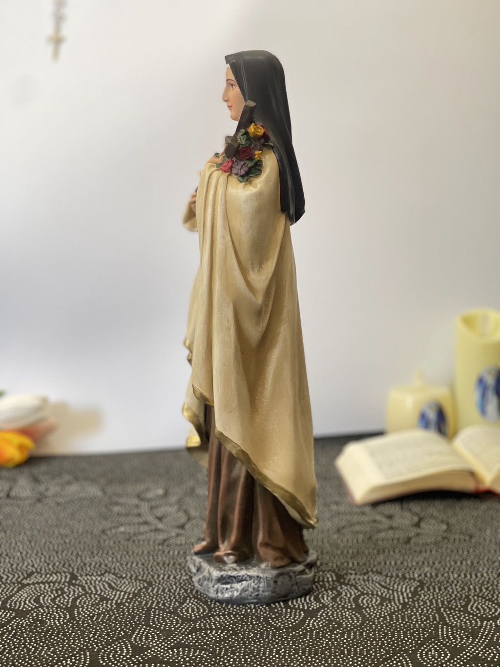Hand-painted Saint Therese of Lisieux statue holding crucifix and roses