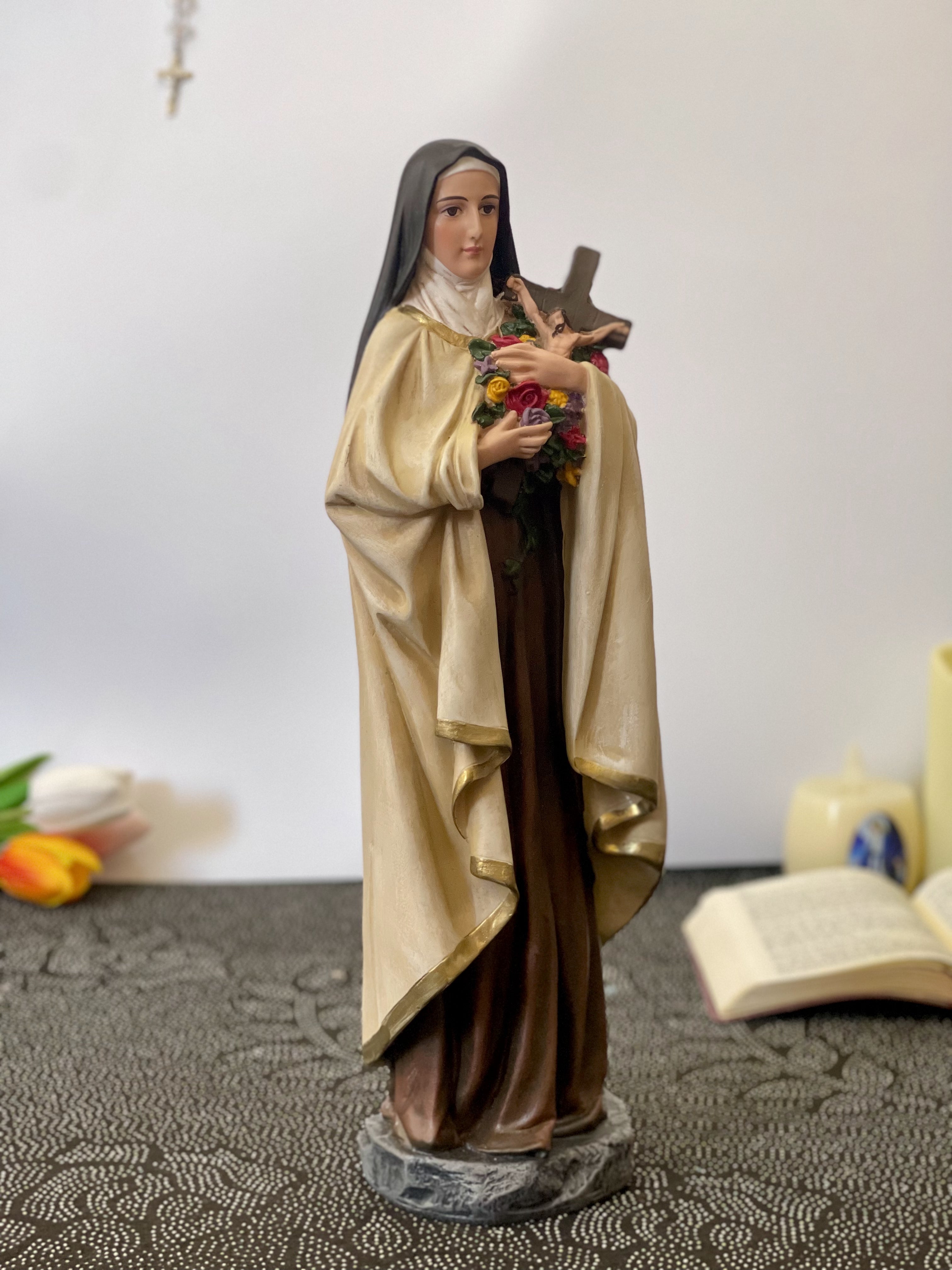 Hand-painted Saint Therese of Lisieux statue holding crucifix and roses