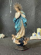 Hand-painted Immaculate Conception Virgin Mary statue with blue mantle, gold halo, and angel base