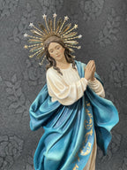 Hand-painted Immaculate Conception Virgin Mary statue with blue mantle, gold halo, and angel base